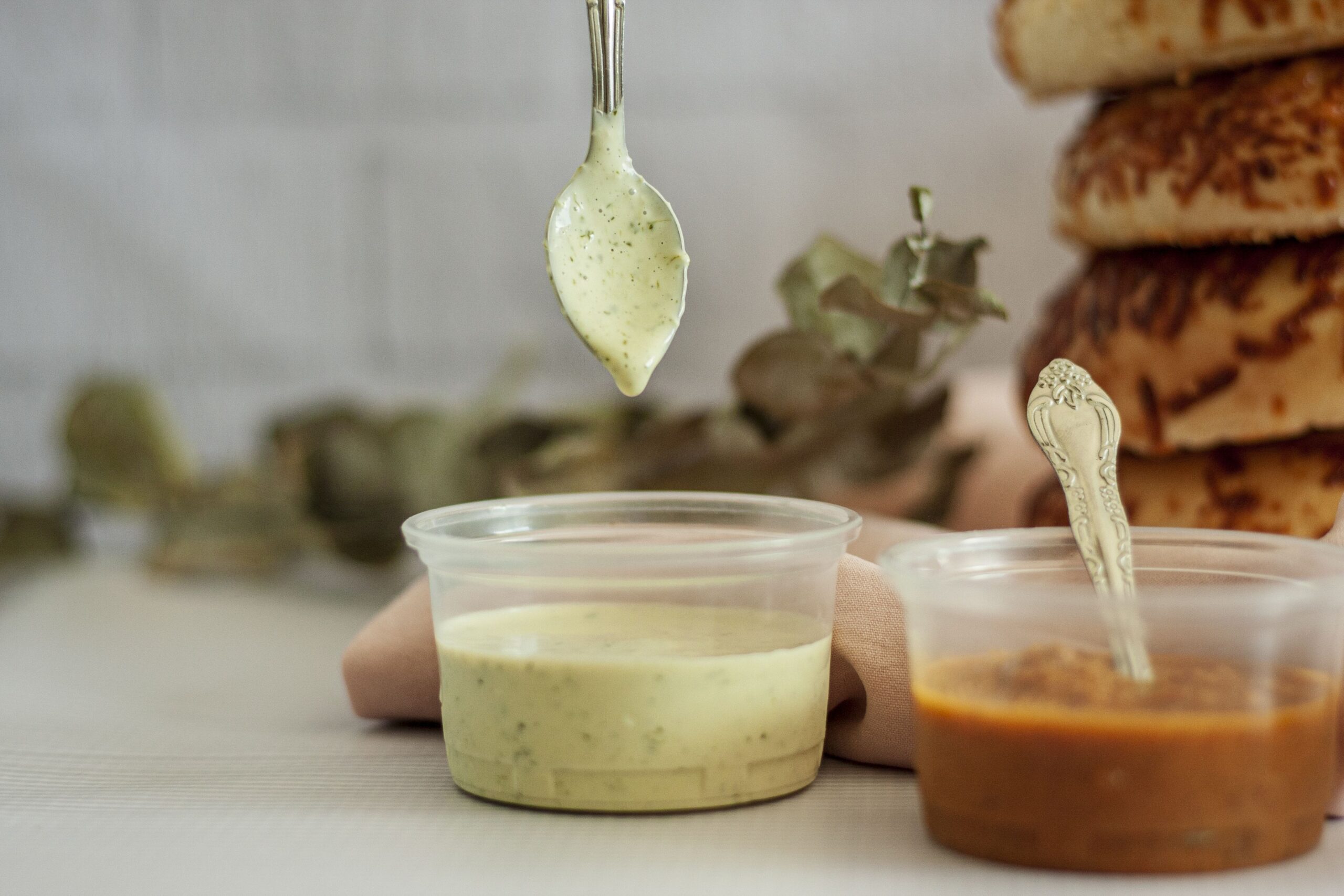 High-quality close-up of homemade guacamole and sauces, ideal for food photography.