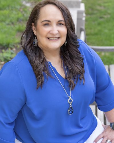 Neena headshot Blue shirt